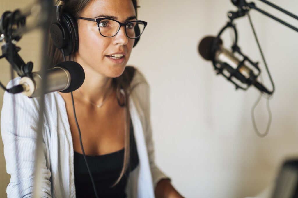 Podcast Concept - Female Host in Podcasting Studio